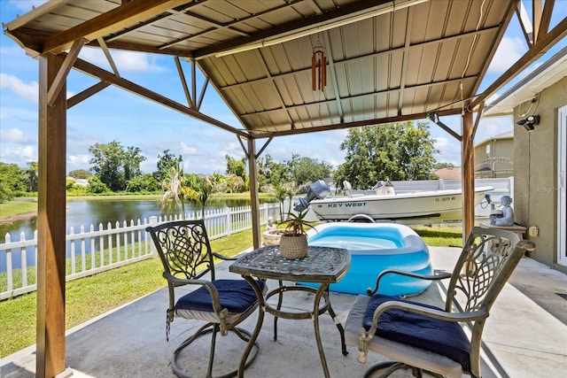 9831 Edmonton Dr, Land O Lakes, FL 34638 - view of patio with a water view
