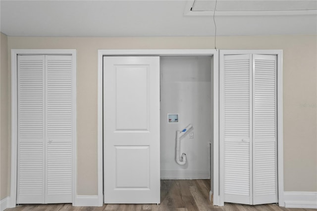 561 Golf And Sea Blvd, Apollo Beach, FL 33572 - unfurnished bedroom with multiple closets and wood finished floors