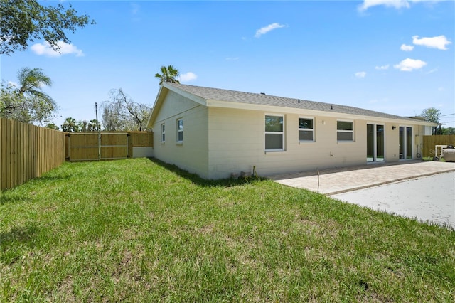 561 Golf And Sea Blvd, Apollo Beach, FL 33572 - rear view of house with a patio area