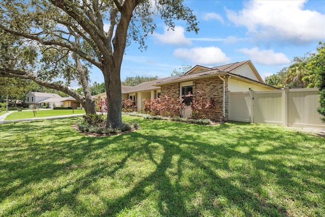 6706 Dunes Ln, Temple Terrace, FL 33617 - ranch-style house featuring brick siding and a gate