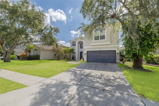 4147 Grandchamp Cir, Palm Harbor, FL 34685 - view of front of house with a garage, stucco siding, concrete driveway, and a front lawn