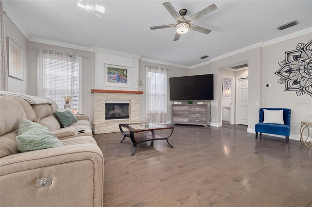 4147 Grandchamp Cir, Palm Harbor, FL 34685 - living room with a ceiling fan, wood finished floors, a stone fireplace, and crown molding