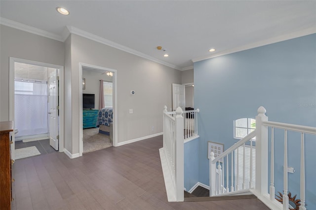 4147 Grandchamp Cir, Palm Harbor, FL 34685 - hall featuring an upstairs landing, recessed lighting, dark wood-style flooring, and crown molding