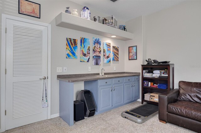 4147 Grandchamp Cir, Palm Harbor, FL 34685 - sitting room with light colored carpet and bar with sink