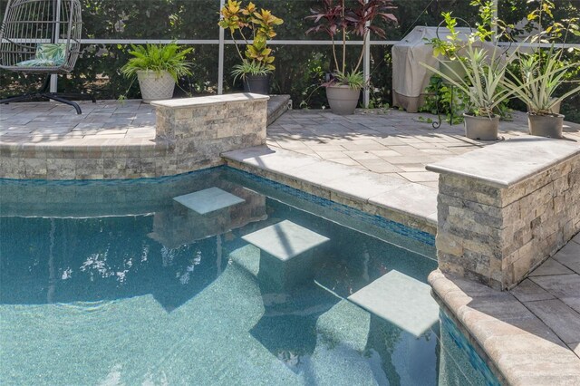 4147 Grandchamp Cir, Palm Harbor, FL 34685 - swimming pool featuring a patio