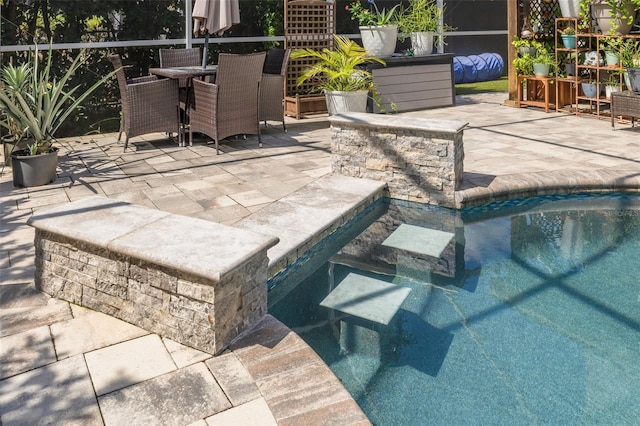 4147 Grandchamp Cir, Palm Harbor, FL 34685 - outdoor pool featuring a patio