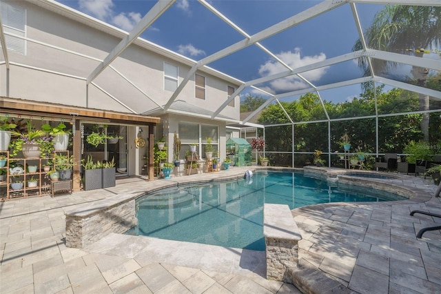 4147 Grandchamp Cir, Palm Harbor, FL 34685 - view of pool with a patio, a pool with connected hot tub, and a lanai