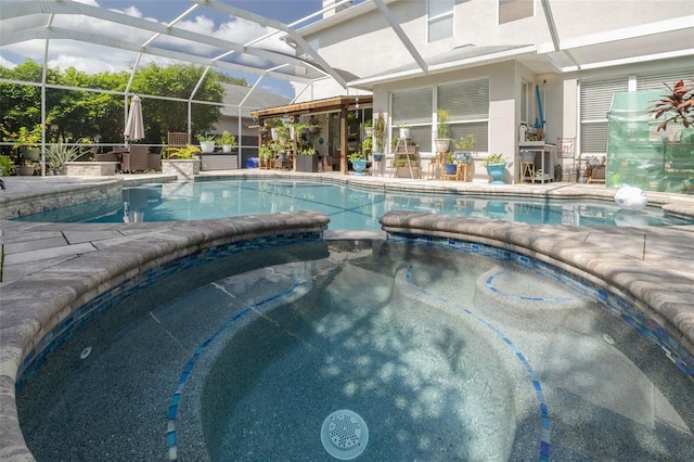 4147 Grandchamp Cir, Palm Harbor, FL 34685 - view of pool with a pool with connected hot tub, a patio, and a lanai