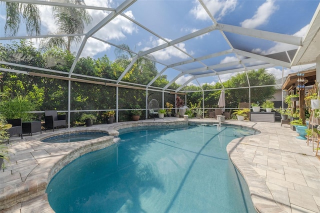 4147 Grandchamp Cir, Palm Harbor, FL 34685 - view of pool with a patio area, a pool with connected hot tub, and glass enclosure