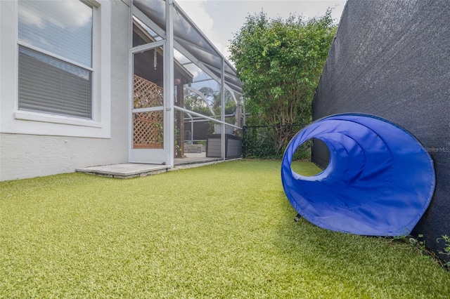 4147 Grandchamp Cir, Palm Harbor, FL 34685 - view of grassy yard featuring glass enclosure