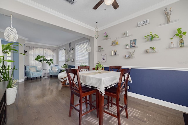 4147 Grandchamp Cir, Palm Harbor, FL 34685 - dining room featuring crown molding, ceiling fan, and wood finished floors