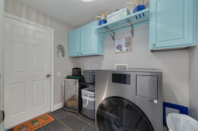 4147 Grandchamp Cir, Palm Harbor, FL 34685 - laundry area featuring cabinet space, washer and clothes dryer, and dark tile patterned flooring