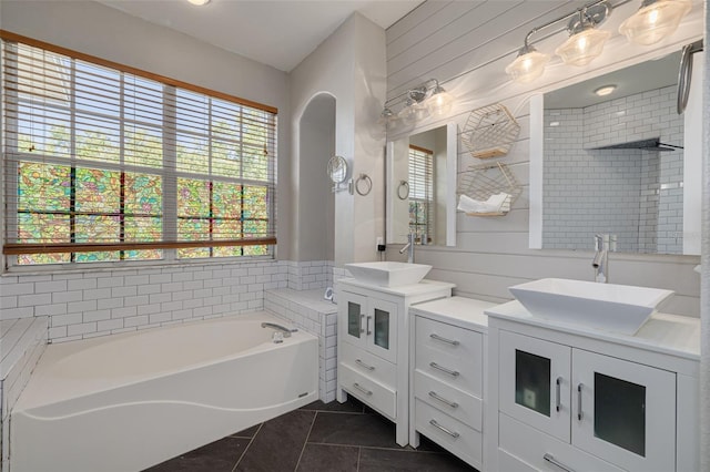4147 Grandchamp Cir, Palm Harbor, FL 34685 - bathroom with tile patterned flooring, two vanities, and a bath