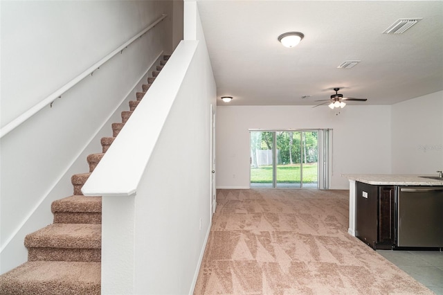12841 Buffalo Run Dr, Gibsonton, FL 33534 - stairway with ceiling fan and carpet floors