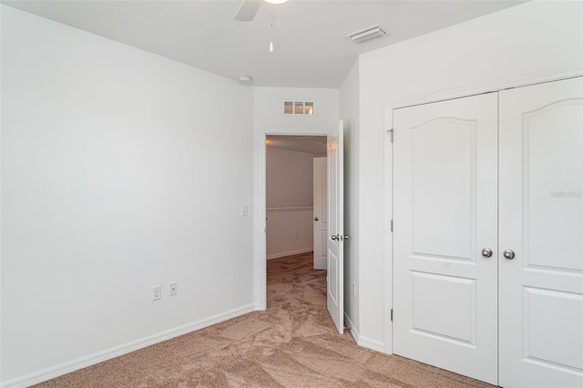 12841 Buffalo Run Dr, Gibsonton, FL 33534 - unfurnished bedroom with light colored carpet, a closet, and ceiling fan