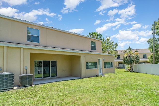 12841 Buffalo Run Dr, Gibsonton, FL 33534 - rear view of house with stucco siding and a patio area