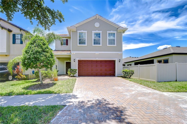 828 Terra Vista St, Brandon, FL 33511 - view of front of property with an attached garage, decorative driveway, and stucco siding