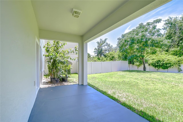 828 Terra Vista St, Brandon, FL 33511 - fenced backyard featuring a patio area