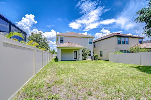 828 Terra Vista St, Brandon, FL 33511 - rear view of house with stucco siding and a tile roof