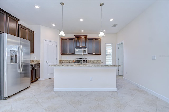 828 Terra Vista St, Brandon, FL 33511 - kitchen with appliances with stainless steel finishes, light tile patterned floors, dark brown cabinets, decorative light fixtures, and recessed lighting