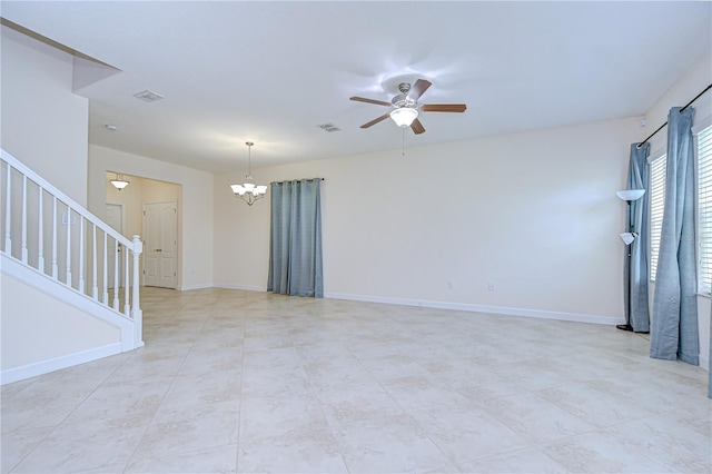 828 Terra Vista St, Brandon, FL 33511 - empty room featuring stairs, a chandelier, a ceiling fan, and light tile patterned floors