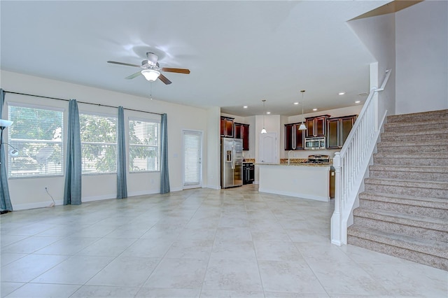 828 Terra Vista St, Brandon, FL 33511 - unfurnished living room featuring a ceiling fan, stairway, light tile patterned flooring, and recessed lighting