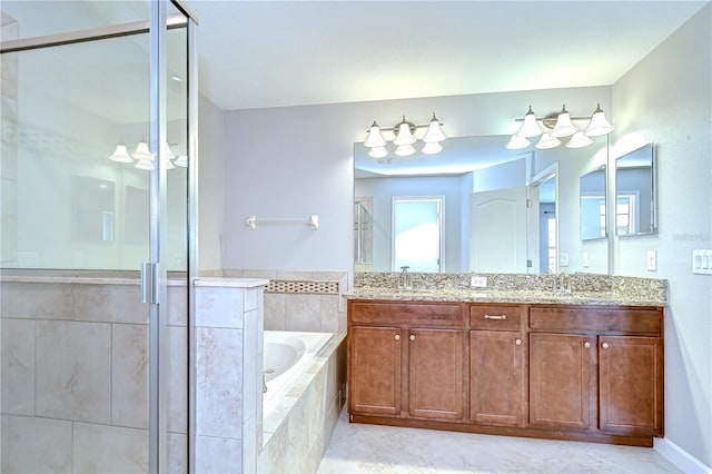 828 Terra Vista St, Brandon, FL 33511 - bathroom with a shower stall, a bath, double vanity, and tile patterned floors