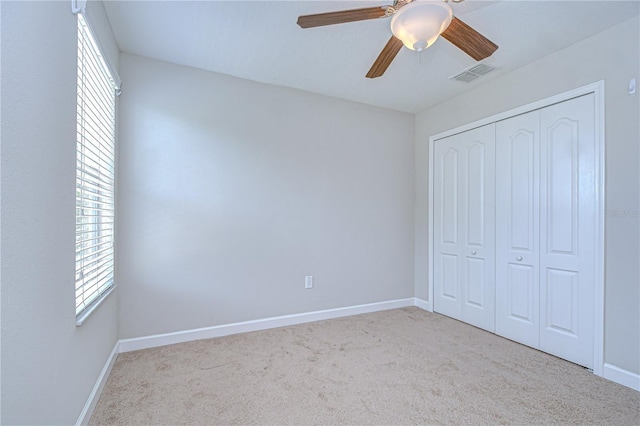 828 Terra Vista St, Brandon, FL 33511 - unfurnished bedroom featuring carpet, multiple windows, and a closet