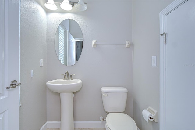 828 Terra Vista St, Brandon, FL 33511 - bathroom with toilet and baseboards