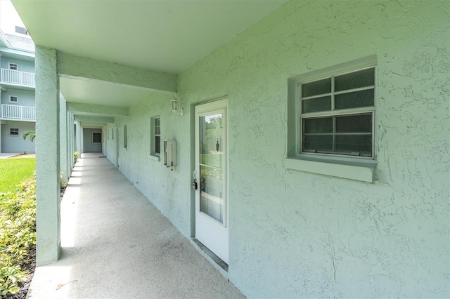 1706 Belleair Forest Dr Unit 146, Belleair, FL 33756 - view of exterior entry featuring stucco siding