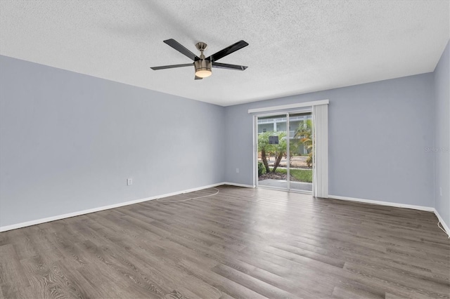 1706 Belleair Forest Dr Unit 146, Belleair, FL 33756 - spare room featuring a textured ceiling, wood finished floors, and ceiling fan