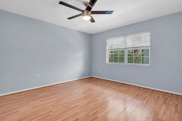 1706 Belleair Forest Dr Unit 146, Belleair, FL 33756 - empty room with light wood finished floors and a ceiling fan