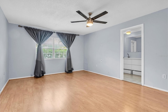 1706 Belleair Forest Dr Unit 146, Belleair, FL 33756 - spare room with ceiling fan and wood finished floors