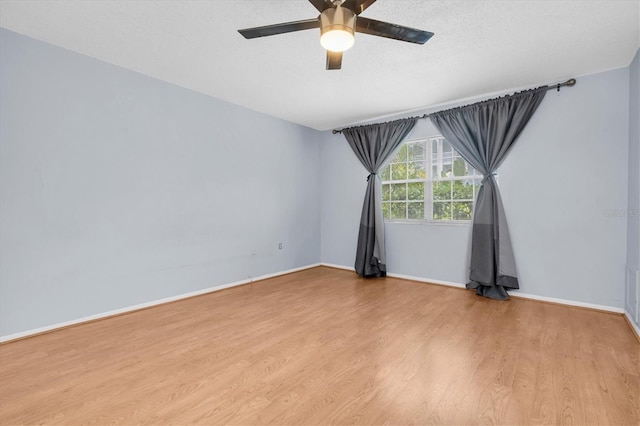1706 Belleair Forest Dr Unit 146, Belleair, FL 33756 - unfurnished room with a ceiling fan and wood finished floors