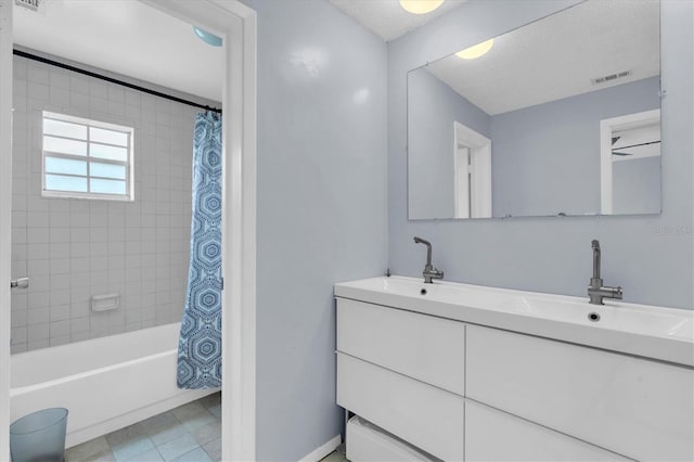 1706 Belleair Forest Dr Unit 146, Belleair, FL 33756 - bathroom with double vanity, shower / tub combo, a textured ceiling, and tile patterned floors