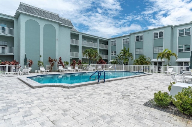1706 Belleair Forest Dr Unit 146, Belleair, FL 33756 - community pool with a patio area