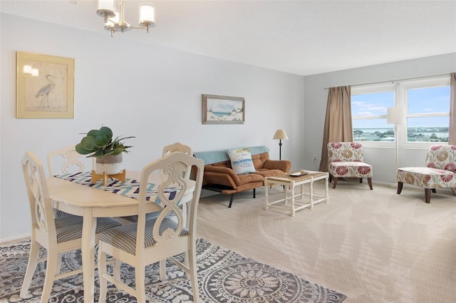4775 Cove Cir Unit 803, Saint Petersburg, FL 33708 - dining space with a chandelier and light colored carpet