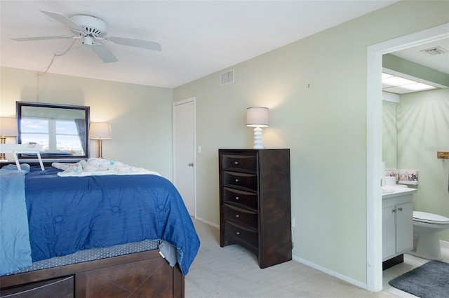 4775 Cove Cir Unit 803, Saint Petersburg, FL 33708 - bedroom featuring light colored carpet, ensuite bathroom, and a ceiling fan