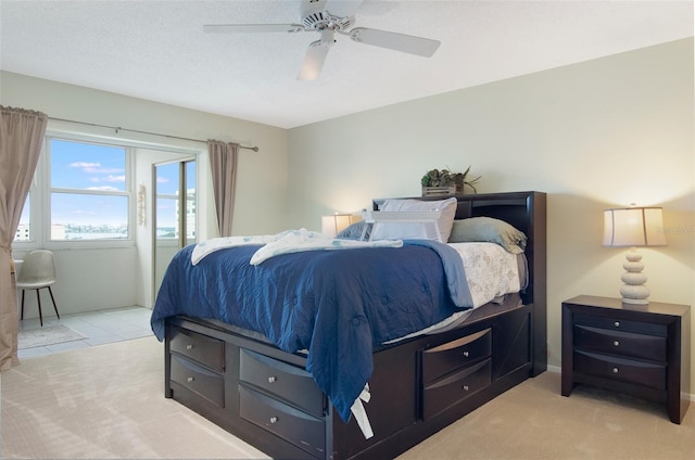 4775 Cove Cir Unit 803, Saint Petersburg, FL 33708 - bedroom featuring light colored carpet and ceiling fan