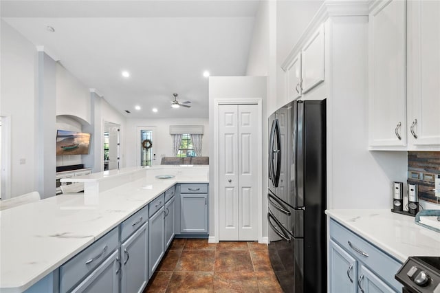 12830 24th Street Cir E, Parrish, FL 34219 - kitchen with freestanding refrigerator, ceiling fan, light stone counters, white cabinets, and recessed lighting