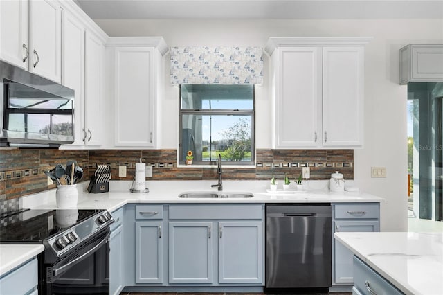 12830 24th Street Cir E, Parrish, FL 34219 - kitchen with stainless steel appliances, tasteful backsplash, white cabinets, and gray cabinets