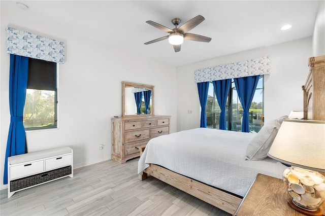 12830 24th Street Cir E, Parrish, FL 34219 - bedroom featuring access to exterior, light wood-style floors, ceiling fan, and recessed lighting