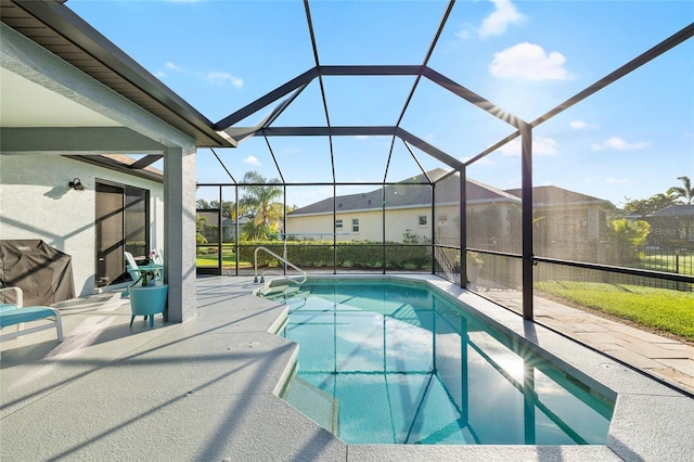 12830 24th Street Cir E, Parrish, FL 34219 - swimming pool with a patio, a residential view, and glass enclosure