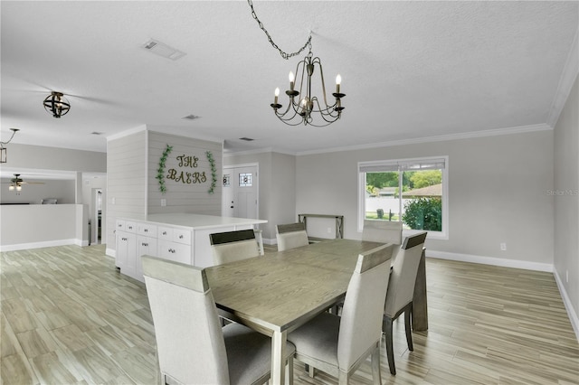 3721 Casaba Loop, Valrico, FL 33596 - dining room featuring ornamental molding, light wood finished floors, a chandelier, a textured ceiling, and ceiling fan