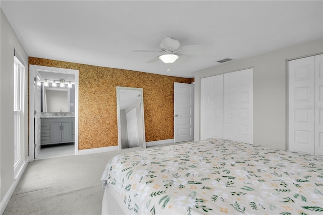 3721 Casaba Loop, Valrico, FL 33596 - bedroom with light colored carpet, multiple closets, a ceiling fan, and ensuite bathroom