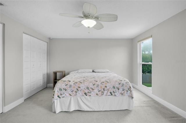 3721 Casaba Loop, Valrico, FL 33596 - bedroom with light carpet, a closet, and a ceiling fan