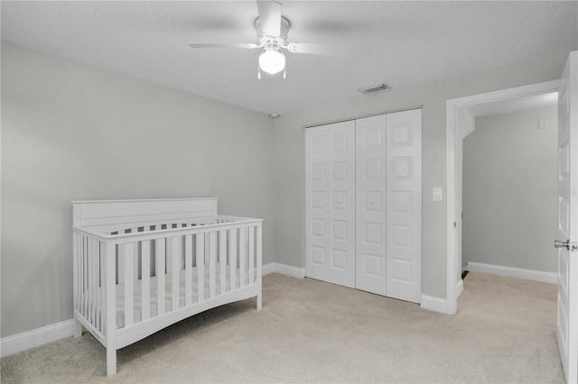 3721 Casaba Loop, Valrico, FL 33596 - carpeted bedroom featuring a closet, a nursery area, and ceiling fan