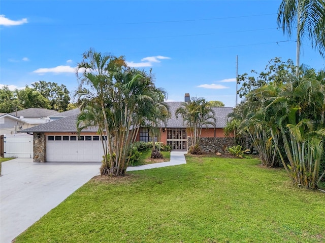 2708 W Bird St, Tampa, FL 33614 - view of front of house with a garage, driveway, roof with shingles, a chimney, and stone siding