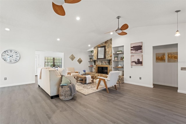 2708 W Bird St, Tampa, FL 33614 - living area featuring a ceiling fan, vaulted ceiling, wood finished floors, a fireplace, and recessed lighting