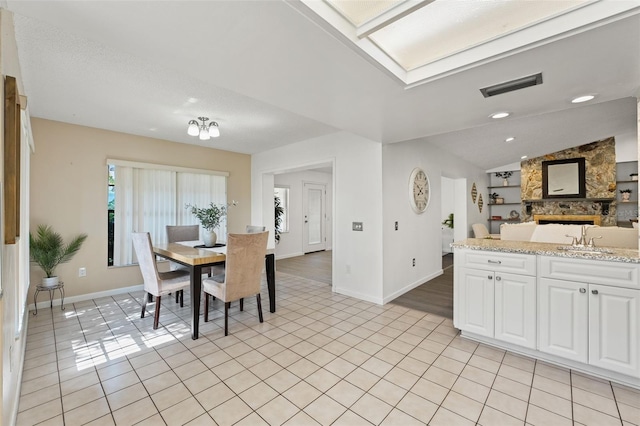 2708 W Bird St, Tampa, FL 33614 - dining room featuring vaulted ceiling and light tile patterned flooring